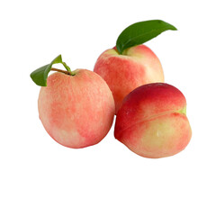 Peach fruit with green leaf on white background.