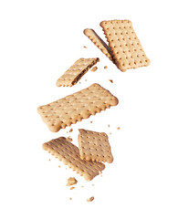 Levitation of whole and crushed crispy cookies in the air isolated on white background
