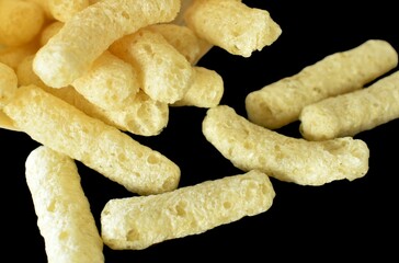 corn sticks on a black background