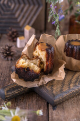 Portion of canele dessert on wooden background