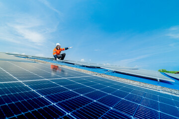 engineer man inspects construction of solar cell panel or photovoltaic cell by electronic device....