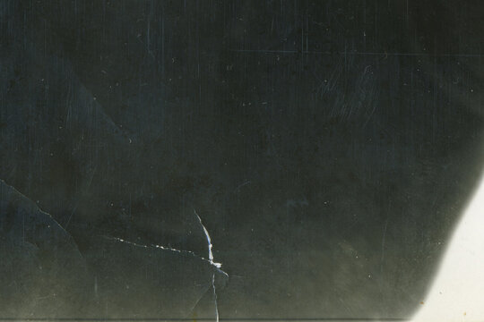 Vintage dirty grunge scan photo paper texture. Old black photo worn overlay distressed background. Vintage scratched glitch effect for design. Folded Edges. Rough grunge shabby torn ripped texture.