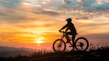 Cyclist silhouetted against a vibrant sunset