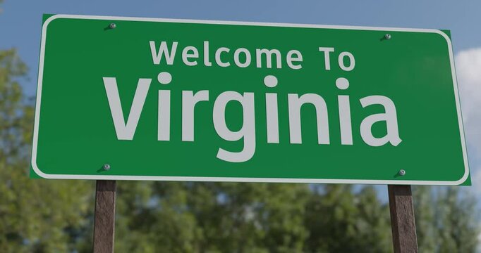 Driving By A Welcome To Virginia Green Road Sign Against a Blue Sky and Clouds.
