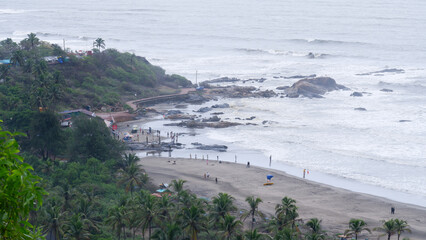Beautiful view of crowd less or empty Vagator beach from chapora fort in in monsoon.