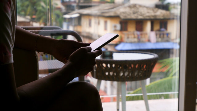 Lady is typing on smart phone, looks like something serious matter. - Powered by Adobe