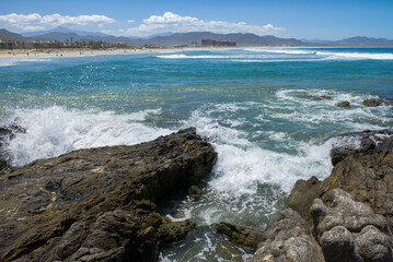 Mountains and sea of ​​the Pacific Ocean on LOS CERRITOS beach, sunny summer vacation day, nature of Todos Santos Baja California Sur. MEXICO Horizontal seascape of The Baja.