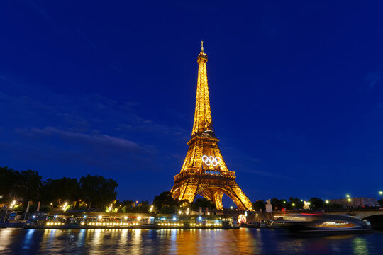 The night view of Eiffel tower with Olympic rings of the Paris 2024 Olympic Games. it is the most visited monument in the world located in 7th district of Paris.