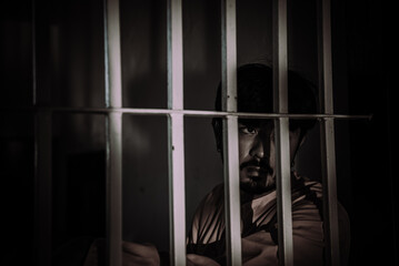 Hands of men desperate to catch the iron prison,prisoner concept,thailand people,Hope to be free.