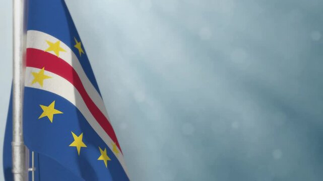 Waving Cabo Verde flag on light blue bokeh backdrop