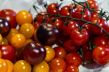 Colourful tomatoes ready to be eaten, with a shallow depth of field