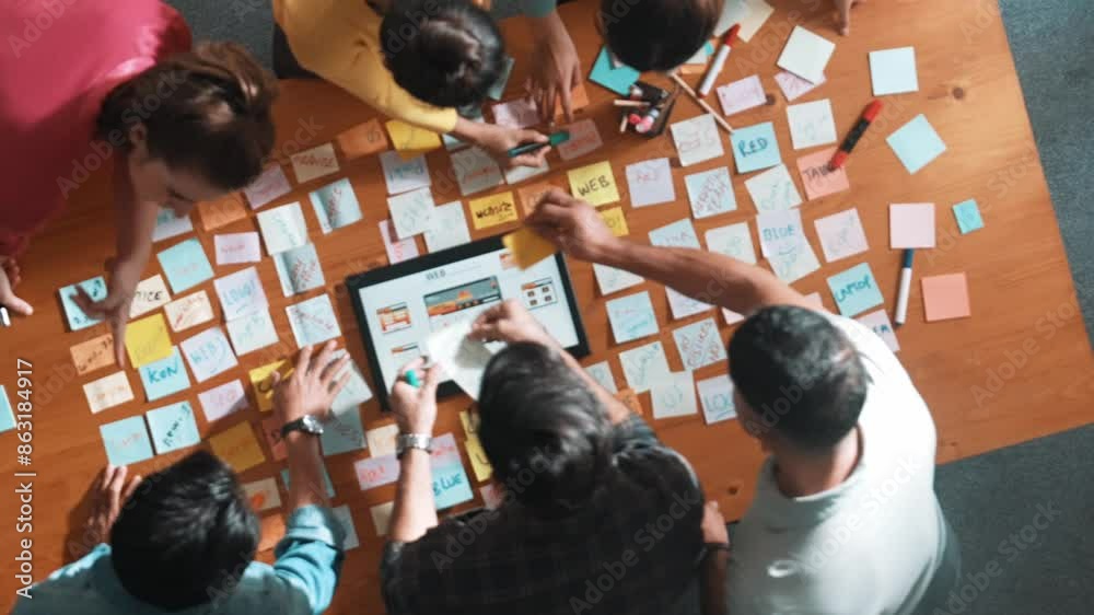 Poster aerial view of developer team discussing and showing digital program and writing by using ux ui desi