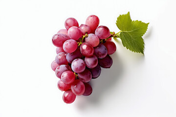 A bunch of purple grapes with a leaf on top. The grapes are wet and shiny. Concept of freshness and abundance