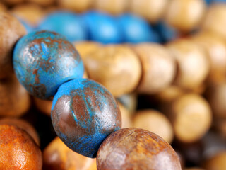 close-up blue and brown wooden beads