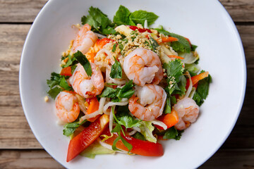 Asian shrimp salad with fresh vegetables on plate