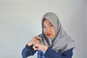 You are late not on time, Asian portrait of a beautiful happy young woman scared casual girl showing and pointing finger her watch studio isolated on background