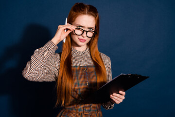 Photo of unsure suspicious lady dressed plaid outfit signing contract looking you isolated dark...