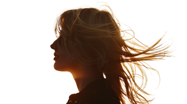 A silhouette of a blonde woman standing against a sunset, hair on wind, summer, on transparent background