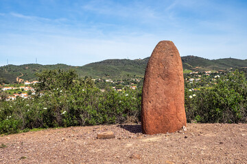 Sandstone Menir dating from 6000-4500 BC in the dry hills near Vale Fuzeiros, Algarve, Portugal.