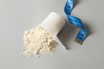 Spoon with protein on colored background