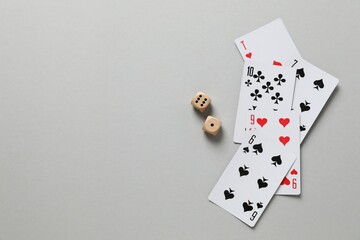 Playing cards on gray background, top view. Gambling concept