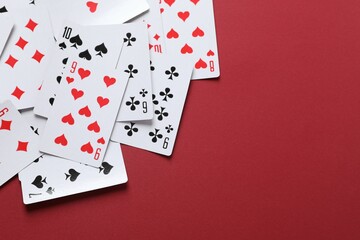 Playing cards on color background, top view. Gambling concept