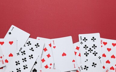Playing cards on color background, top view. Gambling concept