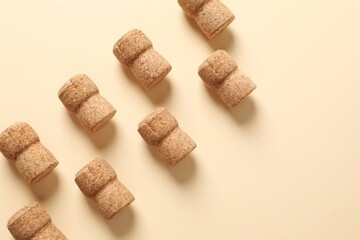 Corks of champagne on colored background
