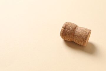 Cork of champagne on colored background