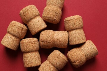 Corks of champagne on colored background