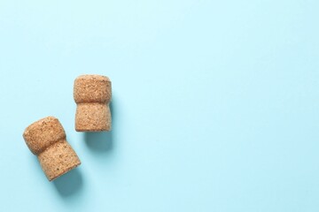 Corks of champagne on colored background