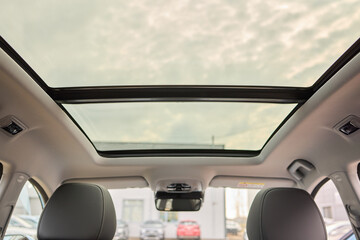 Fototapeta premium Motor vehicle with sunroof, rear view mirror, and hood