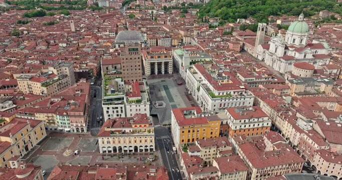 Aerial cityscape of Piazza della Loggia, Brescia, Italy. Urban landscape of the cathedral and the historical square of the tourist town. High quality 4k footage