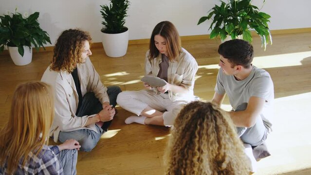 A group of young individuals build strong bonds in a warm and welcoming environment through casual activities, nurturing friendships and creating lasting memories together