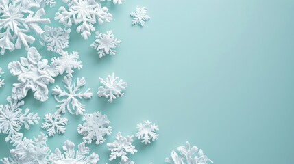 White snowflakes scattered on a light blue background, leaving space for text or design.
