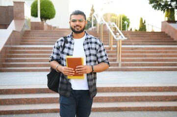 Obraz premium Handsome Indian Young Collage student