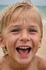 smiling child on the beach