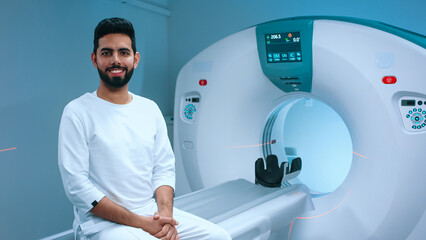 Indian patient undergoing magnetic resonance tomography. Patient getting ready for tomography...