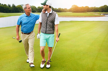 Club, father and man for golf sport, physical activity and bonding through recreation. People, mature dad and son for walking in nature for friendly competition, game and support with talking outdoor