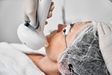 A woman receives IPL therapy in a beauty salon.
