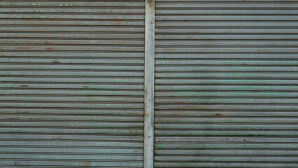 Shutter door texture of a rusty old closed store