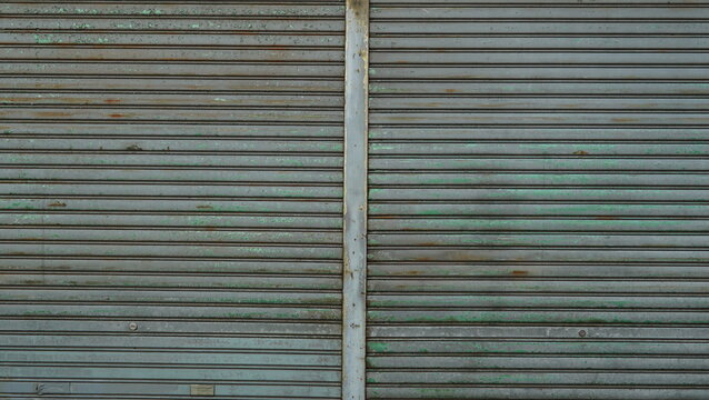 Shutter door texture of a rusty old closed store