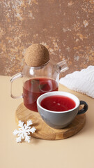 Cup and teapot with warm drink still life. Winter atmosphere teatime