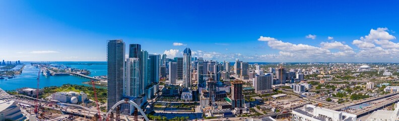 Obraz premium Aerial panoramic photo Downtown Miami, Florida, USA. stitched photo 2024. View of skyscrapers Dade County business district
