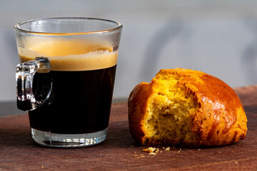 Espresso with cornbread on rustic cutting board