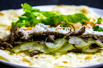 Traditional Shawarma sandwich fresh roll of, Grilled Meat and salad tortilla wrap with white sauce isolated on white background. Details