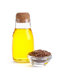 Bottle of flax oil and glass bowl with seeds on white background