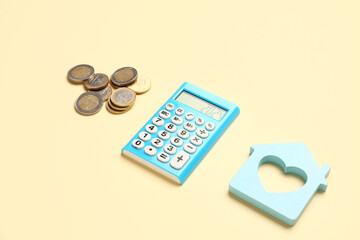 Calculator with number 2024, coins and decorative house on yellow background