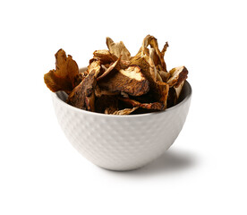 Bowl with tasty dried mushrooms on white background
