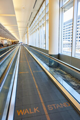 Modern Airport Moving Walkway with Walk Stand Signs Eye-Level Perspective